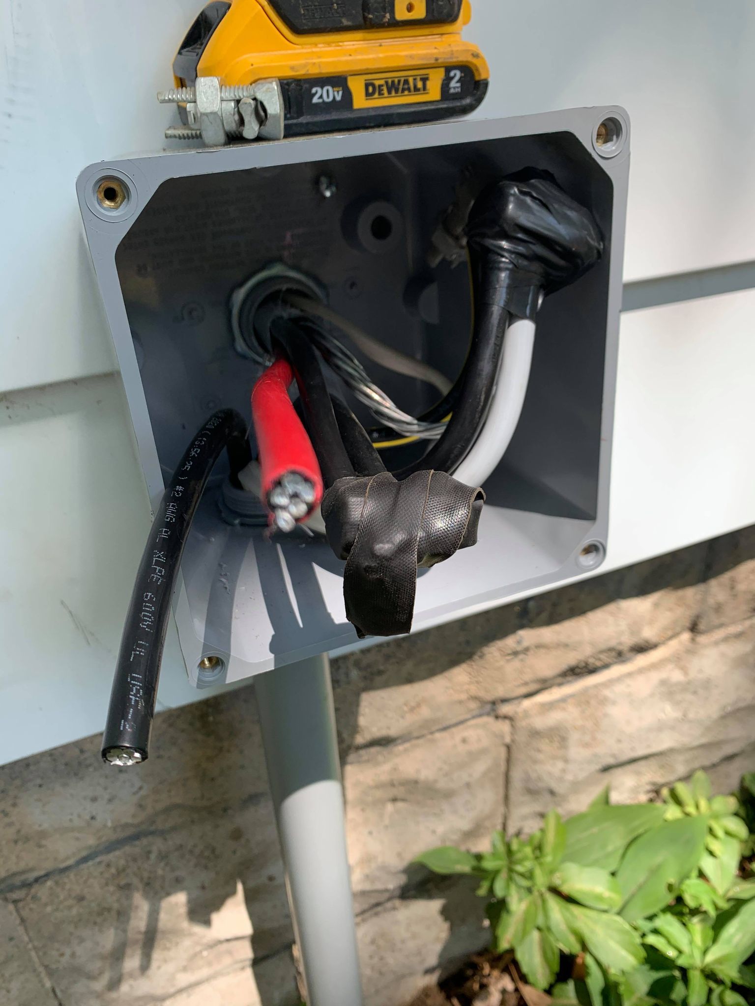 An electrician-recommended power outlet with a cord attached, perfect for commercial or industrial applications in Erie, PA.